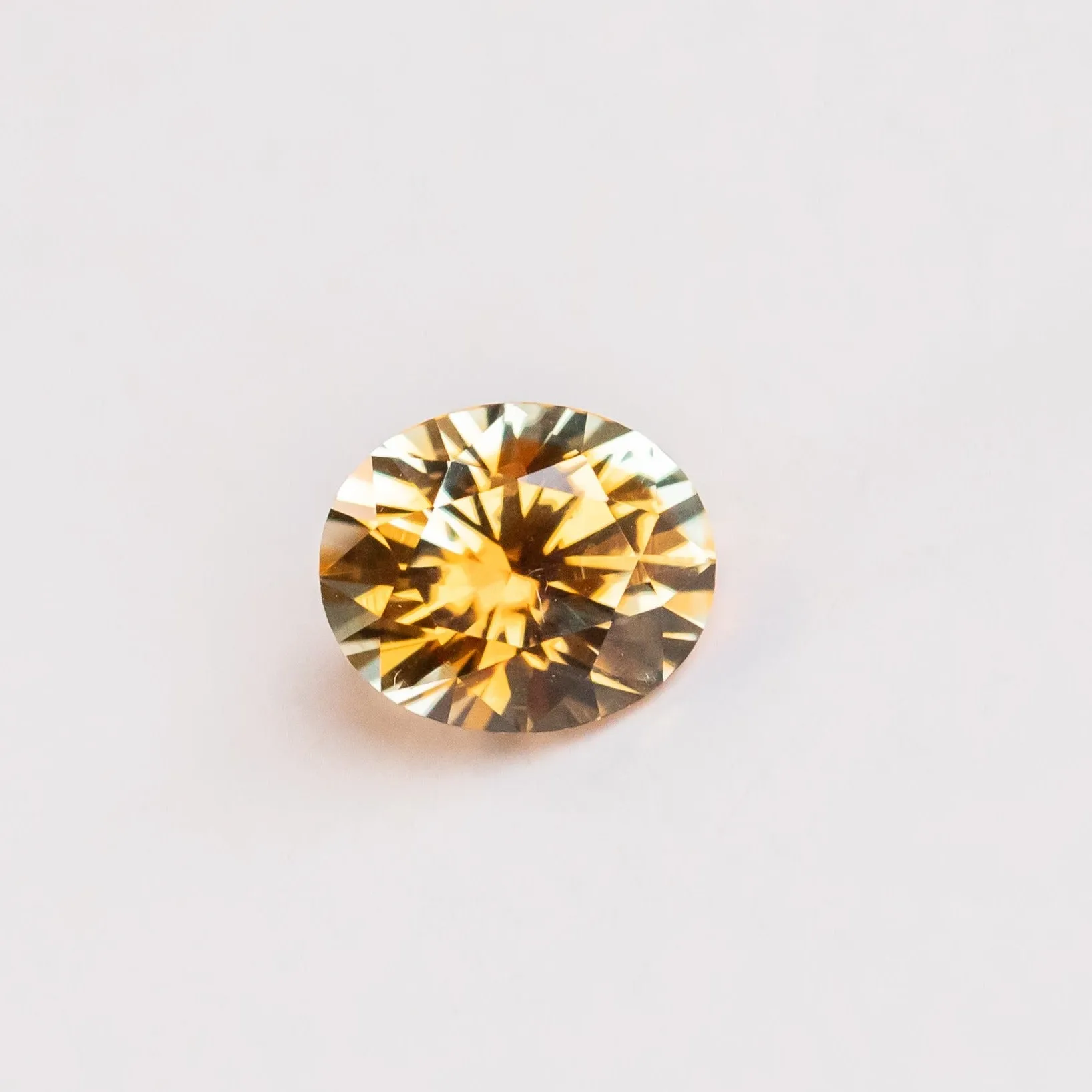 2.35CT OVAL PRECISION CUT MONTANA SAPPHIRE, BICOLOR PARTI ORANGE YELLOW CHAMPAGNE, 8.37X6.98MM