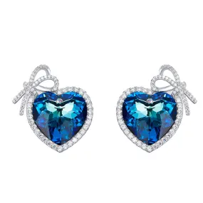 Sterling silver blue topaz heart with a bow earring